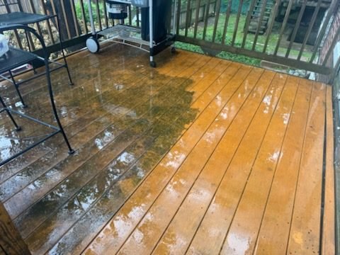 Deck mid-stain, showing the color transformation